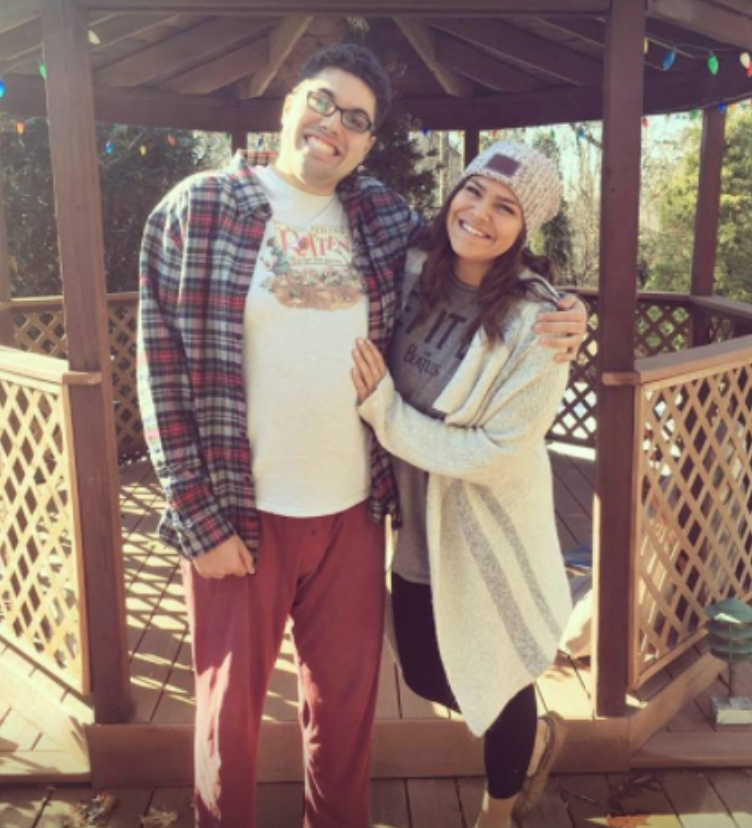 sister and brother with autism posing for photo