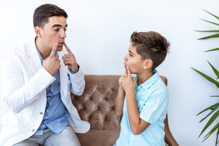 BCBA working with child with autism on communication skills