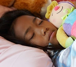 child-sleeping-with-doll.jpg
