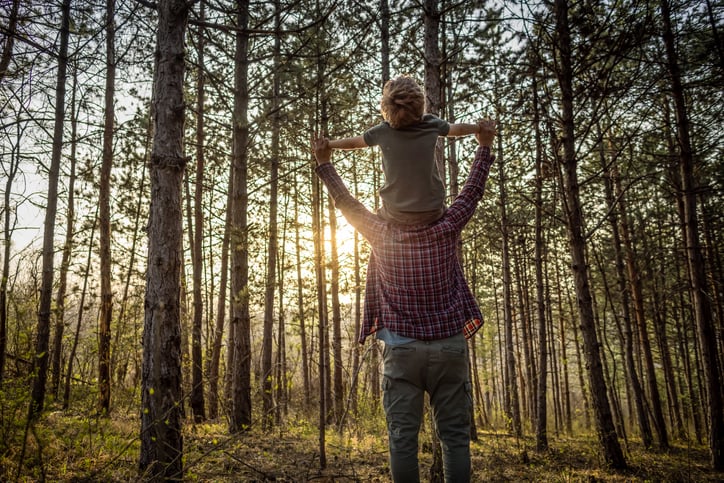 Father and son with autism in nature