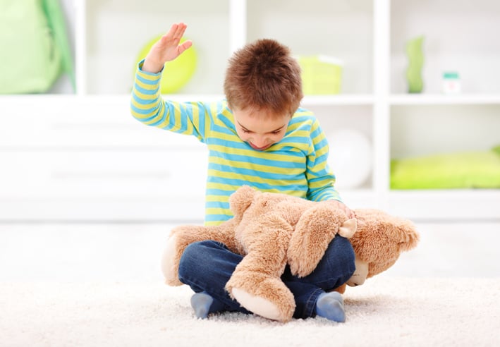 boy with autism exhibiting aggressive behavior