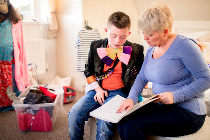 boy with autism reviewing lines from a script