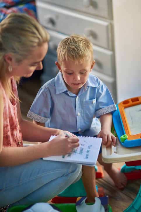 boy with autism using check list for SMART goals