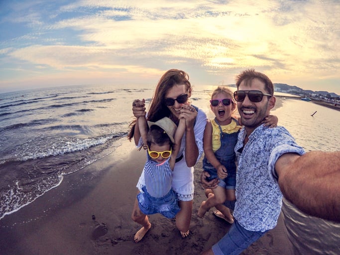 family laughing at autism friendly beach resort