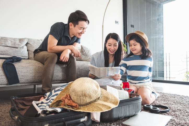 family planning their vacation and packing
