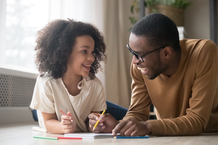father and daughter communicating in writing
