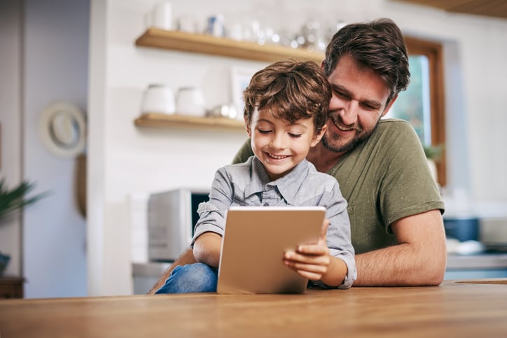 father and son with autism using an app