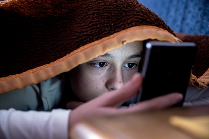 boy with autism experiencing bullying and going through social withdrawal
