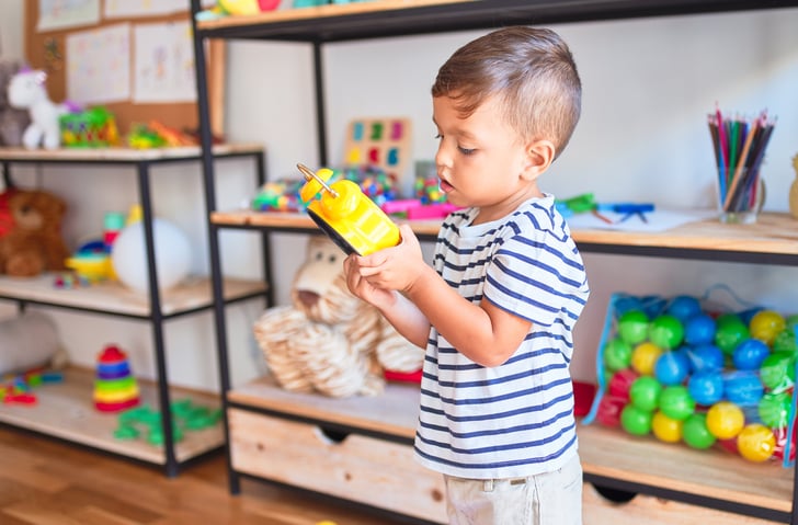 child with autism looking at a timer