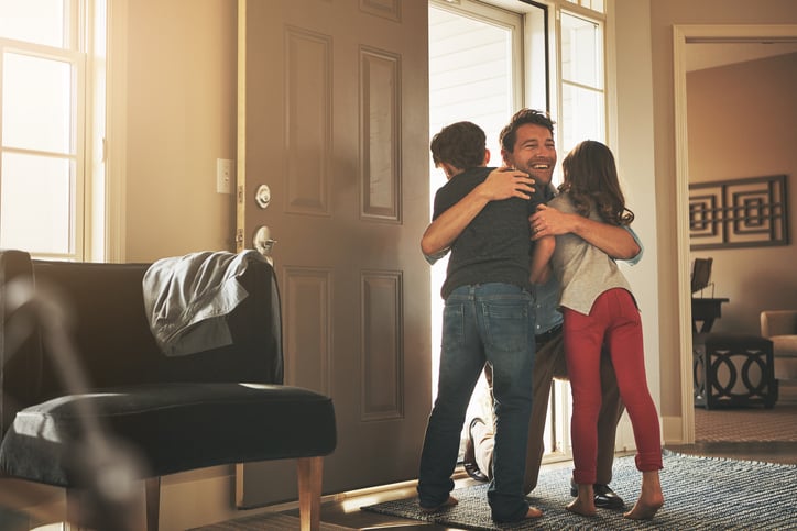 divorced father hugging children