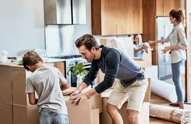 family packing moving box