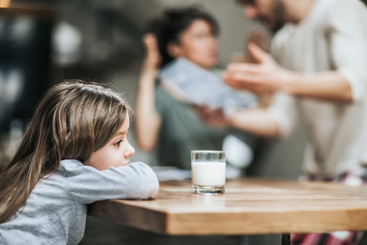 girl with autism listening to parents arguing