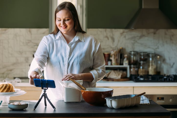 girl with autism recording cooking in the kitchen