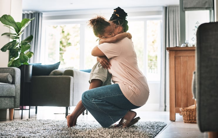mother comforting young girl with autism