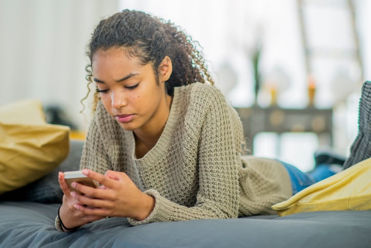 teenager with autism texting