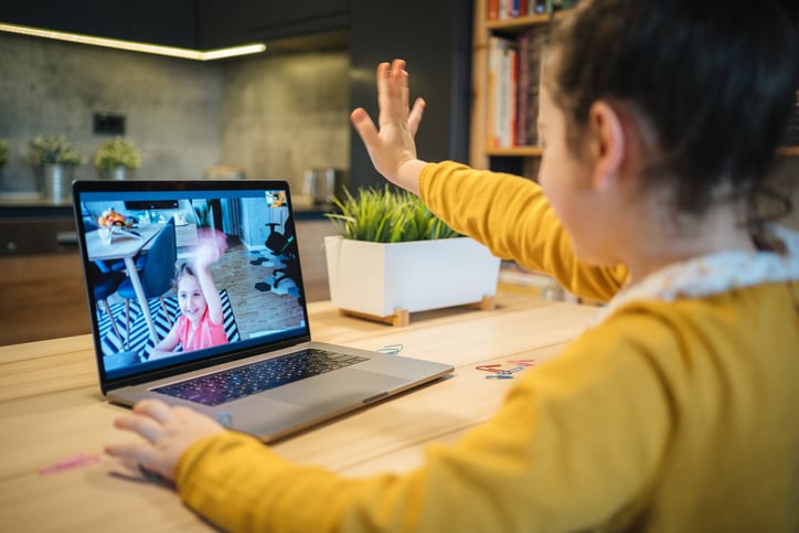 two girls socializing on zoom during covid19 pandemic