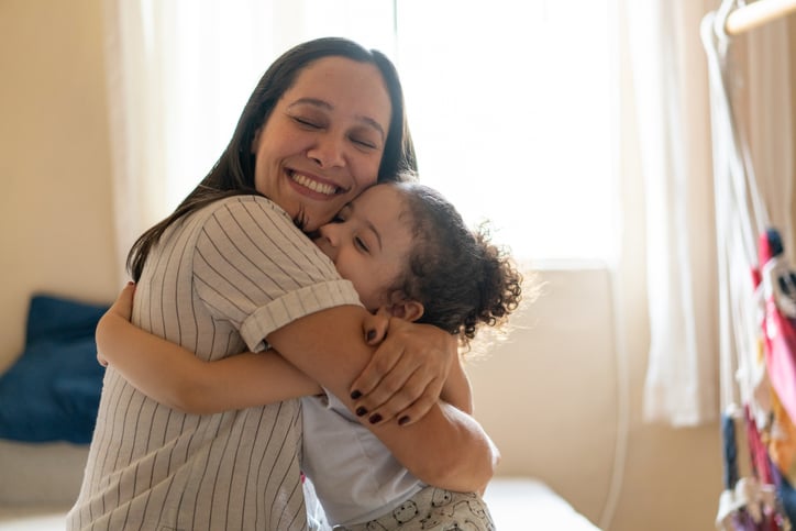 mother hugging child with autism