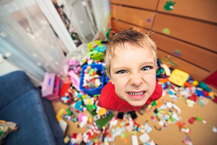 Naughty and messy little boy with autism