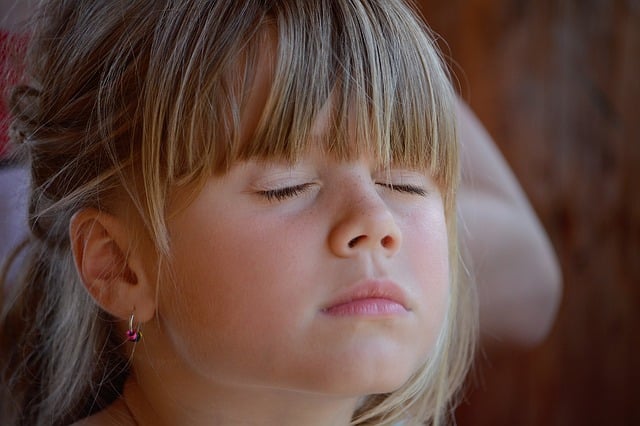 autistic girl with eyes closed