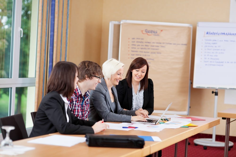 mixed working group looking at laptop.jpeg