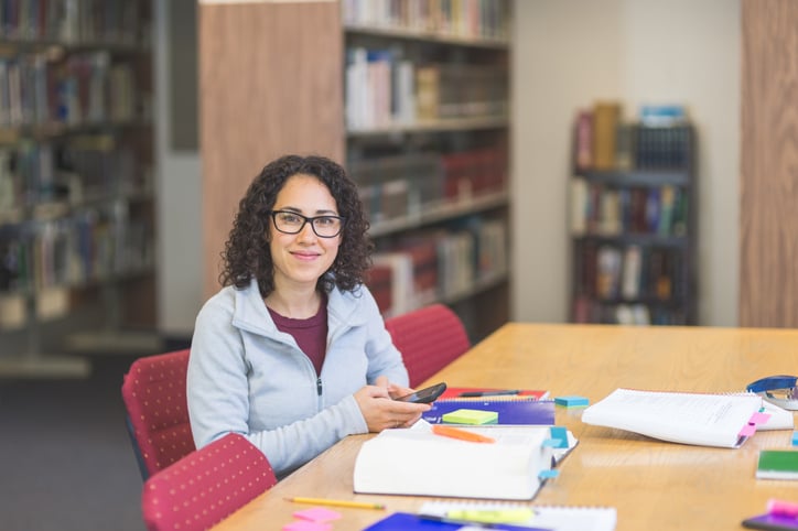 teacher reading research and lesson planning