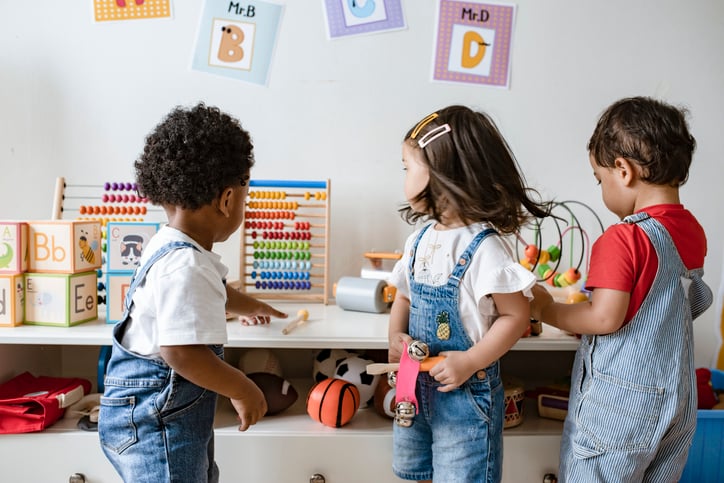 Young children autism mixed race playing with educational toys