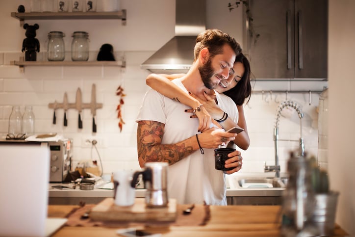 couple-at-home-using-smartphone